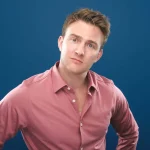 Comedian Tom Houghton looking at the camera with a puzzled face